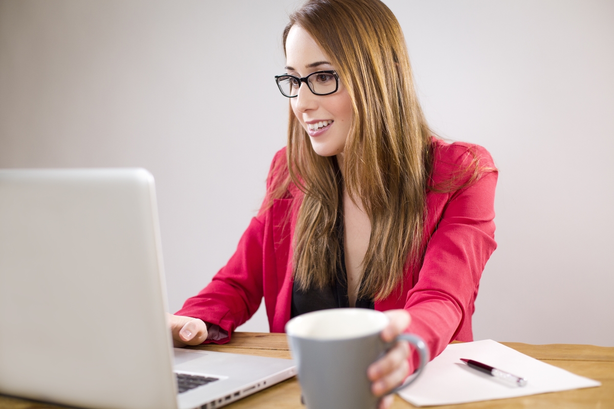 Woman working from home in front of laptop